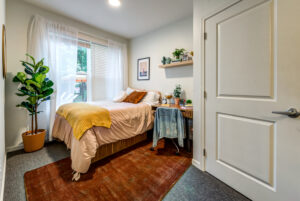 modern bedroom with fiddle leaf fig paloma kent apartments